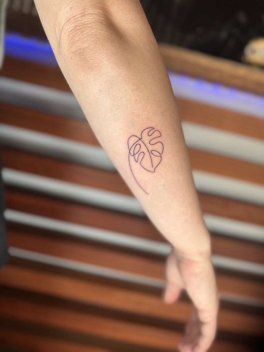 Fine line minimalist nature tattoo by Coolangatta tattoo artist